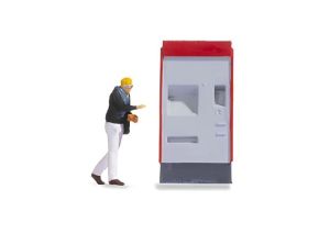 NOC16529 - Small scenes - Figure with dispenser on the station platform