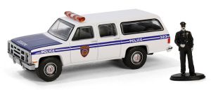 GREEN97160-D - GMC Suburban 2500 1985 Police with figurine from THE HOBBY SHOP series in blister pack